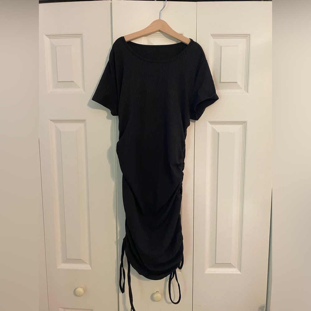 A black, bodycon, dress from Shein.
